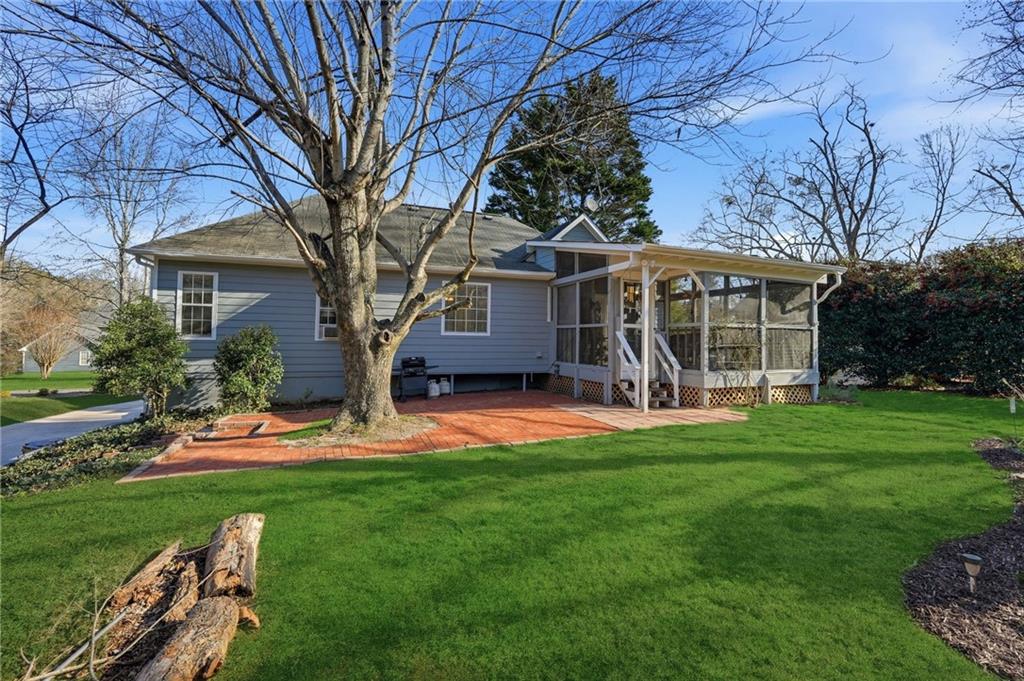 2240 McBrayer Court Cumming, GA 30028 - Photo 26 of 35 front view of a house with a yard