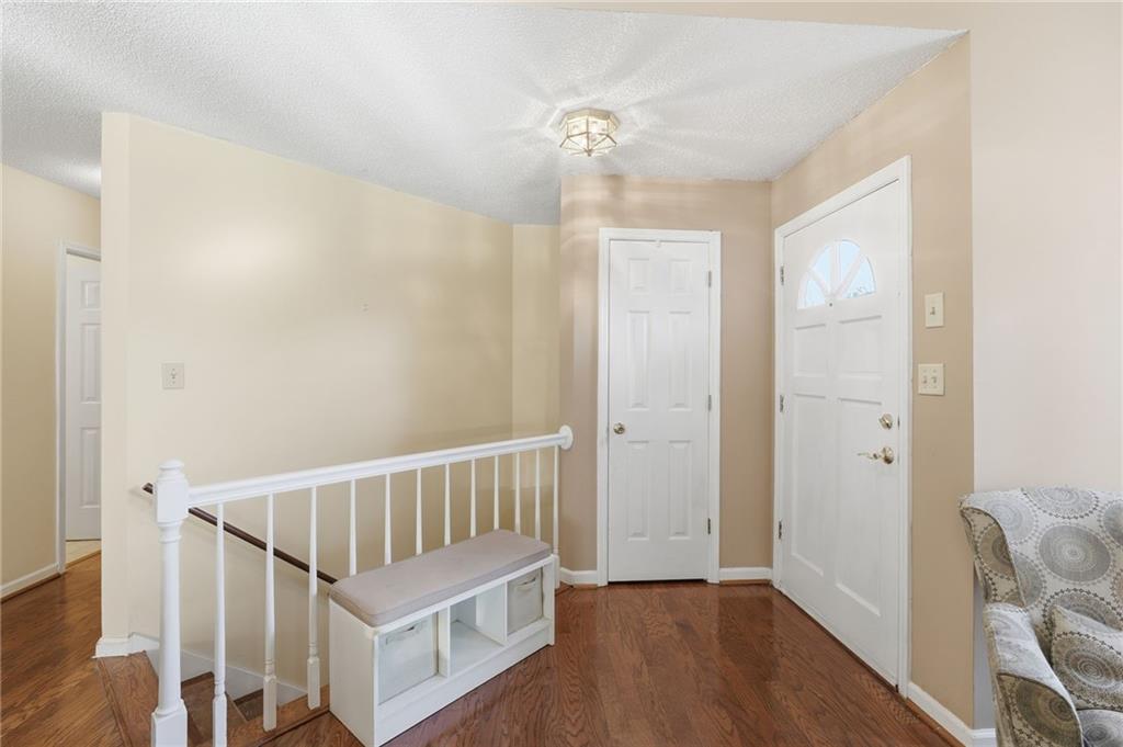 2240 McBrayer Court Cumming, GA 30028 - Photo 3 of 35 a view of entryway with wooden floor