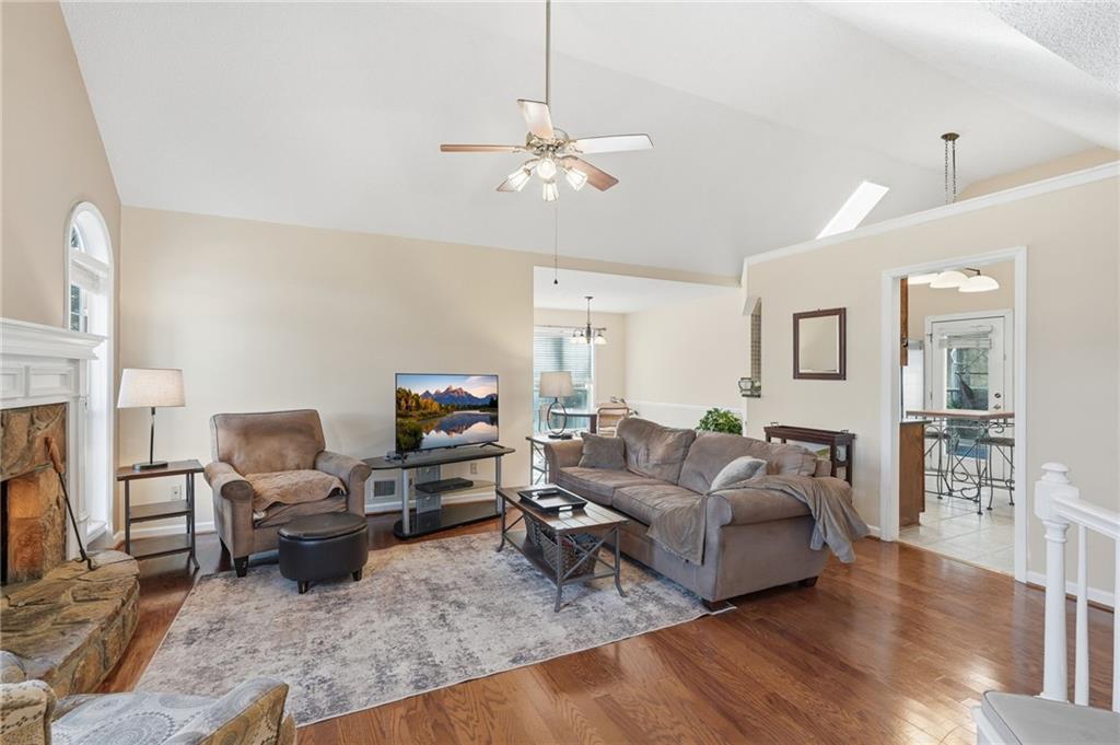 2240 McBrayer Court Cumming, GA 30028 - Photo 4 of 35 a living room with furniture and a fireplace