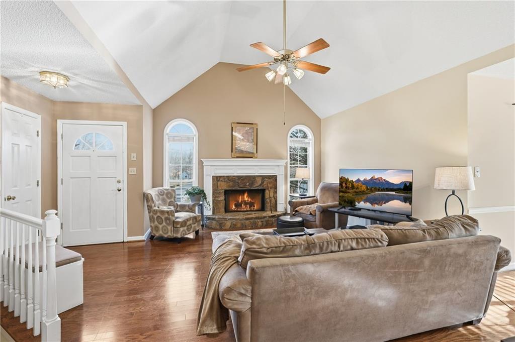 2240 McBrayer Court Cumming, GA 30028 - Photo 5 of 35 a living room with furniture and a fireplace