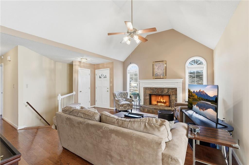 2240 McBrayer Court Cumming, GA 30028 - Photo 6 of 35 a living room with furniture and a fireplace