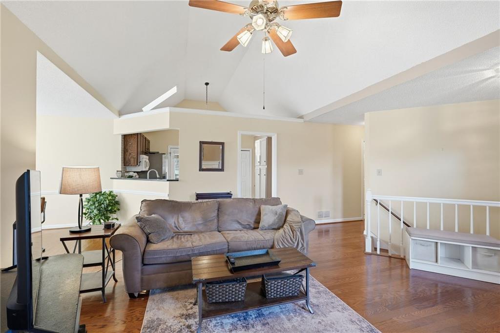 2240 McBrayer Court Cumming, GA 30028 - Photo 7 of 35 a living room with furniture and wooden floor