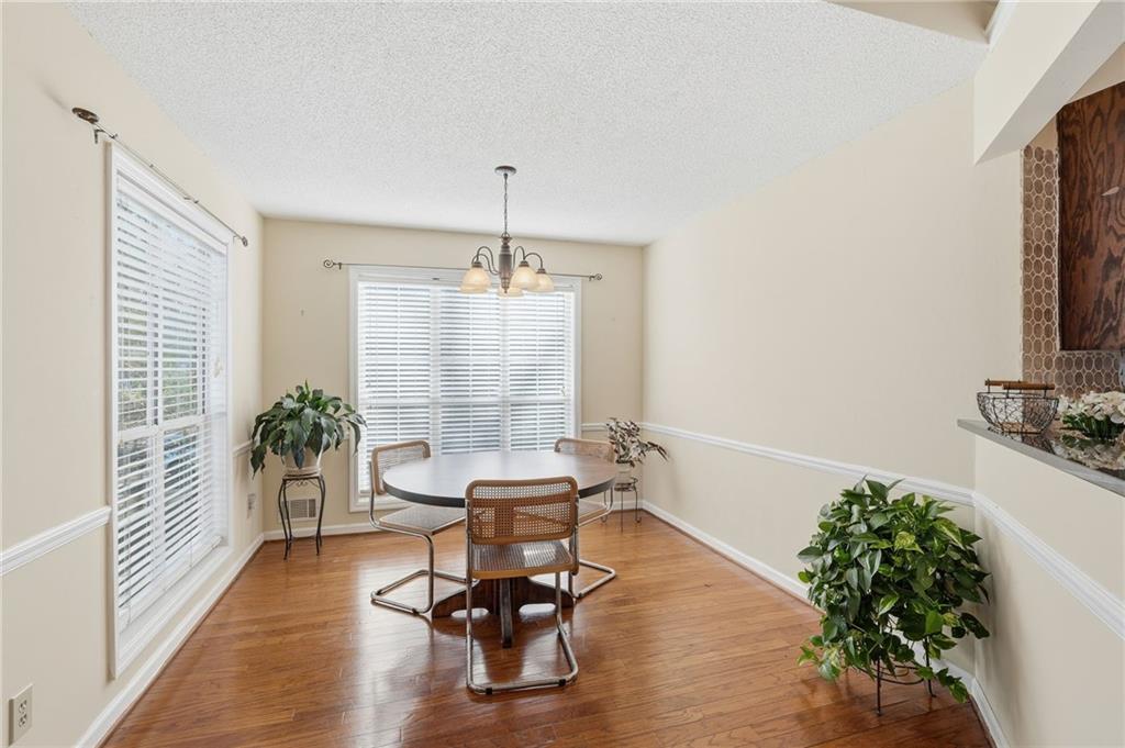 2240 McBrayer Court Cumming, GA 30028 - Photo 8 of 35 a living room with furniture and a potted plant