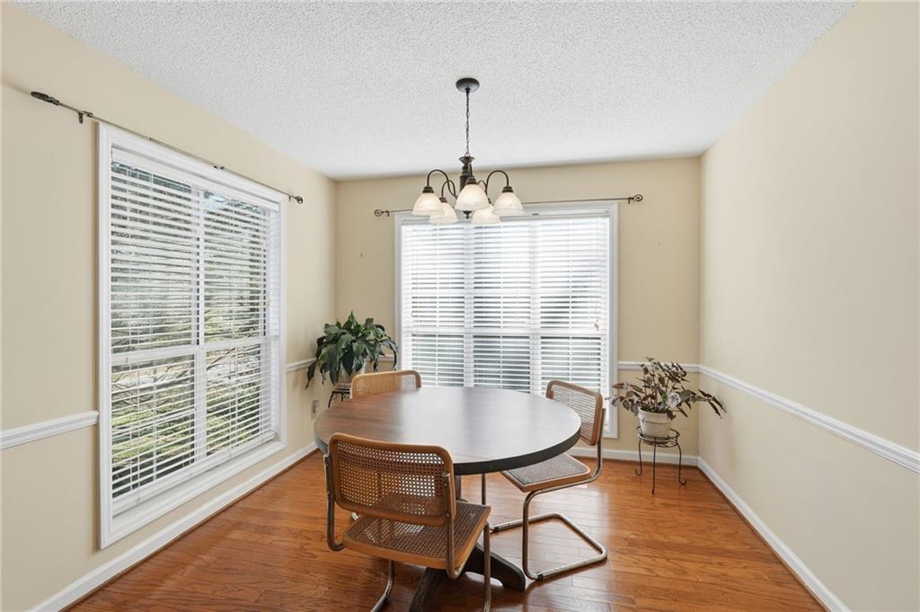 2240 McBrayer Court Cumming, GA 30028 - Photo 9 of 35 a dining room with furniture and window