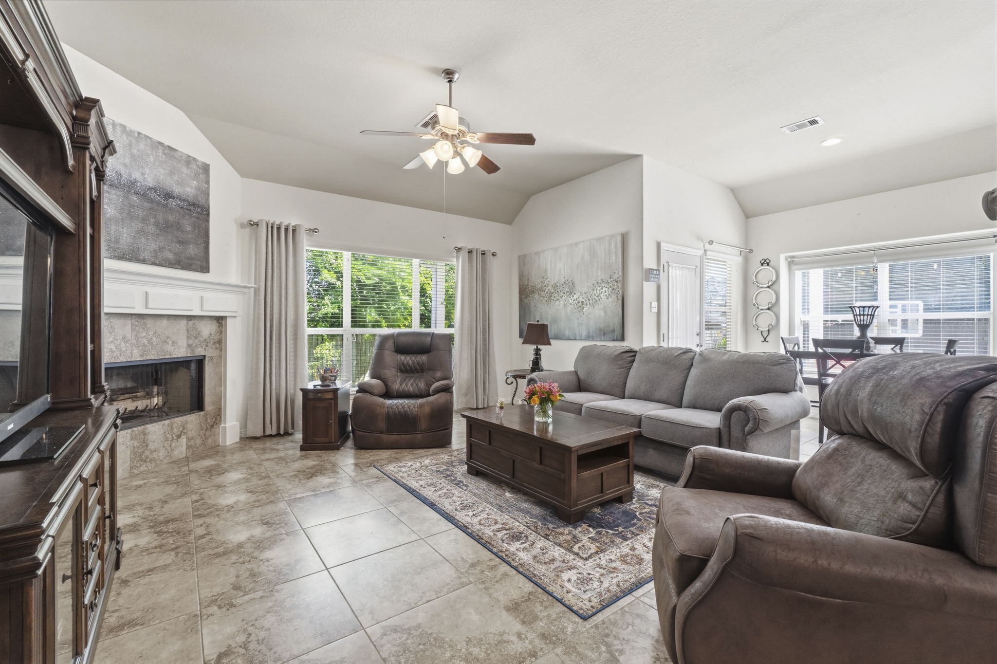 10802 Windswept Montgomery, TX 77356 - Photo 24 of 42 a living room with furniture a fireplace and a flat screen tv