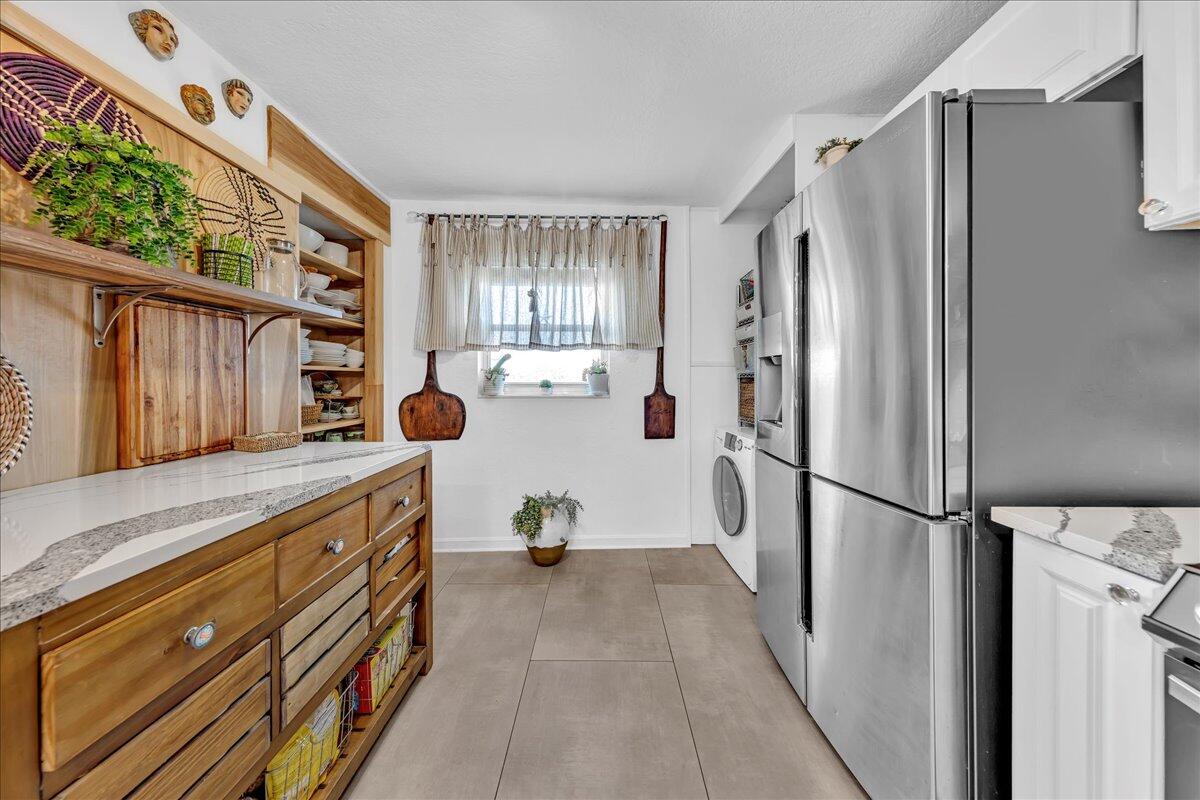 1523 East Hillsboro Boulevard, Unit 531 Deerfield Beach, FL 33441 - Photo 12 of 71 a kitchen with stainless steel appliances a refrigerator and a stove