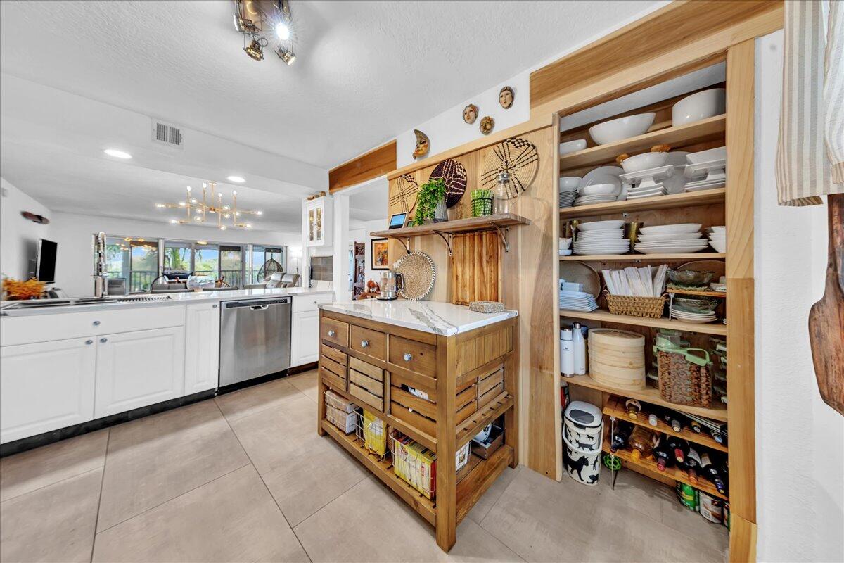 1523 East Hillsboro Boulevard, Unit 531 Deerfield Beach, FL 33441 - Photo 14 of 71 a kitchen with stainless steel appliances cabinets and a sink