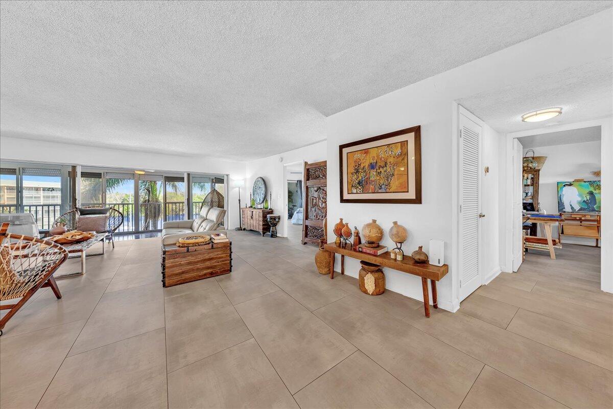 1523 East Hillsboro Boulevard, Unit 531 Deerfield Beach, FL 33441 - Photo 17 of 71 a living room with furniture and white walls