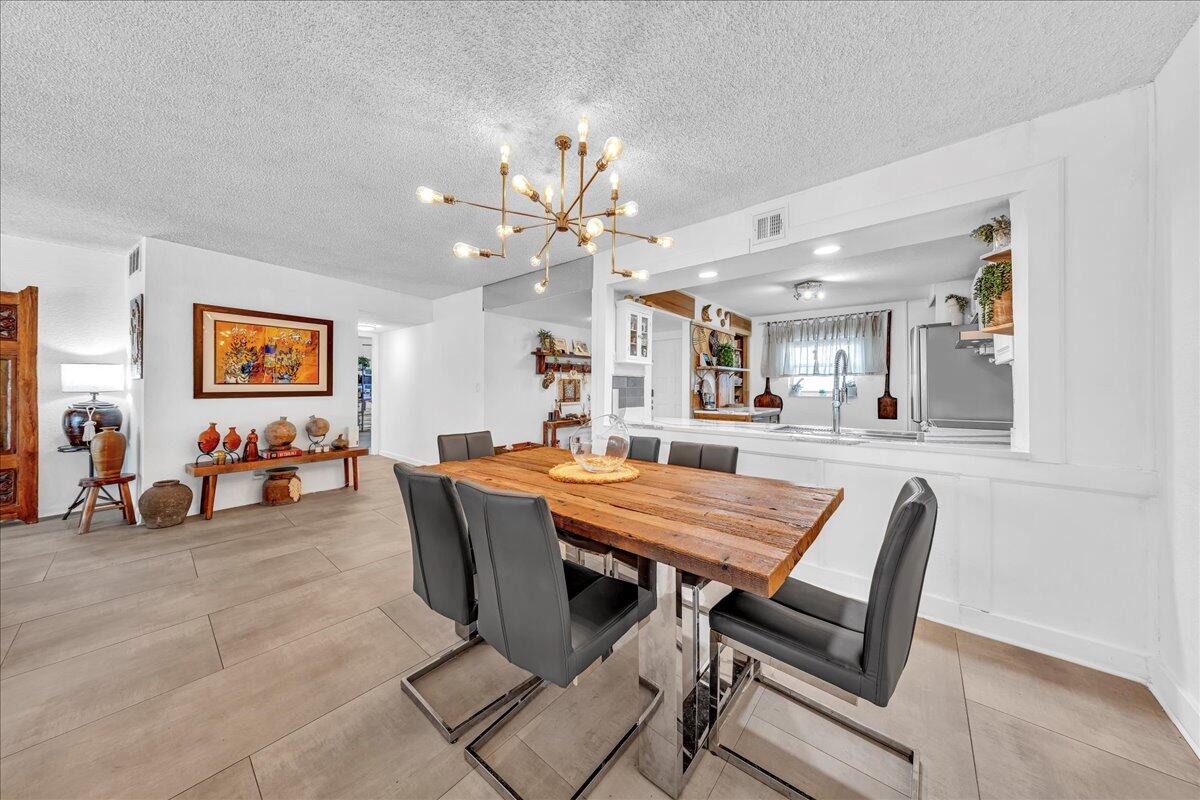 1523 East Hillsboro Boulevard, Unit 531 Deerfield Beach, FL 33441 - Photo 25 of 71 a view of a dining room and livingroom with furniture