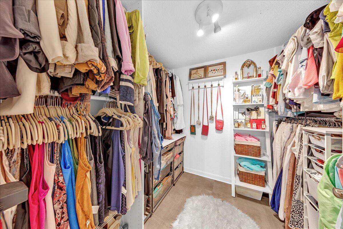 1523 East Hillsboro Boulevard, Unit 531 Deerfield Beach, FL 33441 - Photo 28 of 71 a view of walk in closet with clothes and shoes
