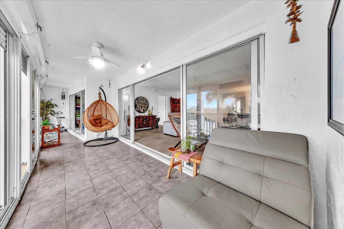 1523 East Hillsboro Boulevard, Unit 531 Deerfield Beach, FL 33441 - Photo 37 of 71 a living room with furniture a table and chair