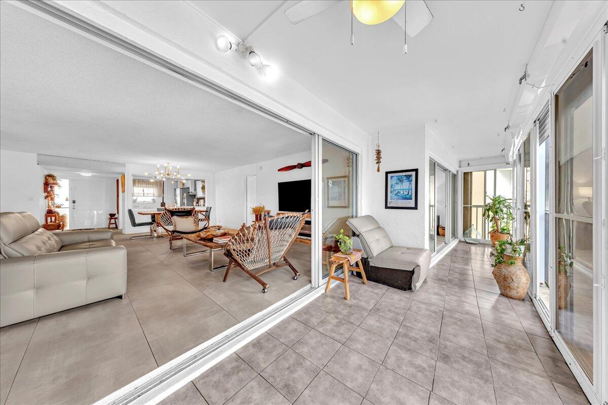 1523 East Hillsboro Boulevard, Unit 531 Deerfield Beach, FL 33441 - Photo 40 of 71 a living room with furniture and a flat screen tv