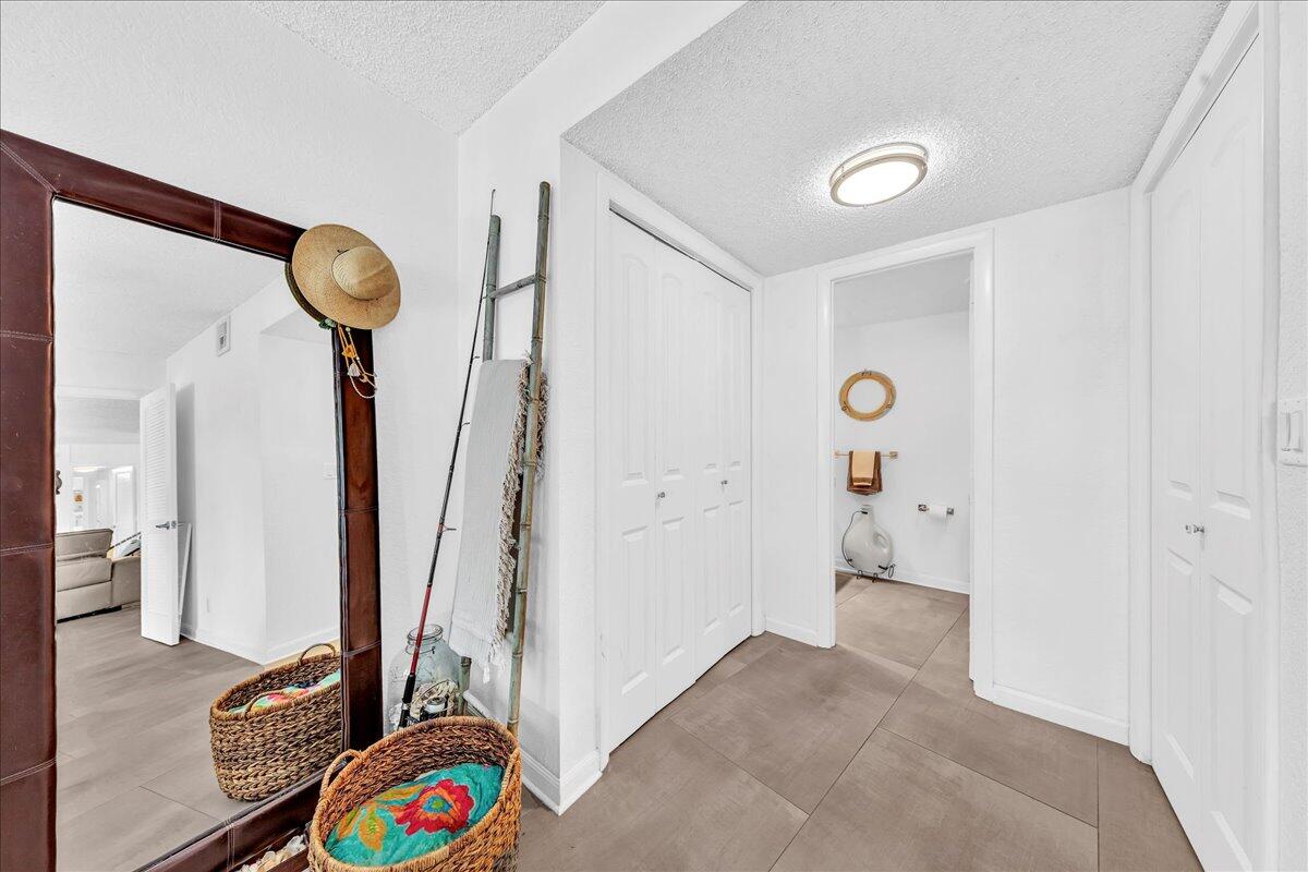 1523 East Hillsboro Boulevard, Unit 531 Deerfield Beach, FL 33441 - Photo 45 of 71 a view of room with hardwood floor and a ceiling fan
