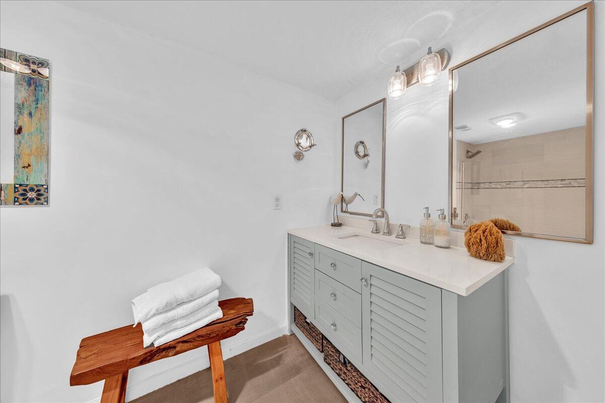 1523 East Hillsboro Boulevard, Unit 531 Deerfield Beach, FL 33441 - Photo 53 of 71 a bathroom with a sink and a mirror