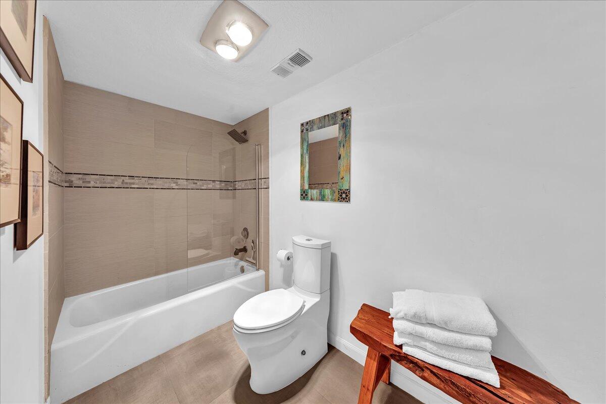 1523 East Hillsboro Boulevard, Unit 531 Deerfield Beach, FL 33441 - Photo 54 of 71 a bathroom with a toilet a sink and bathtub