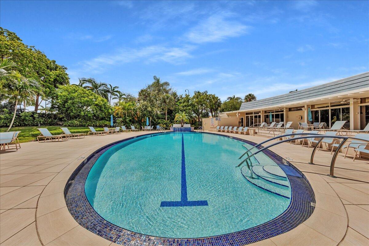 1523 East Hillsboro Boulevard, Unit 531 Deerfield Beach, FL 33441 - Photo 56 of 71 a view of a swimming pool with outdoor seating