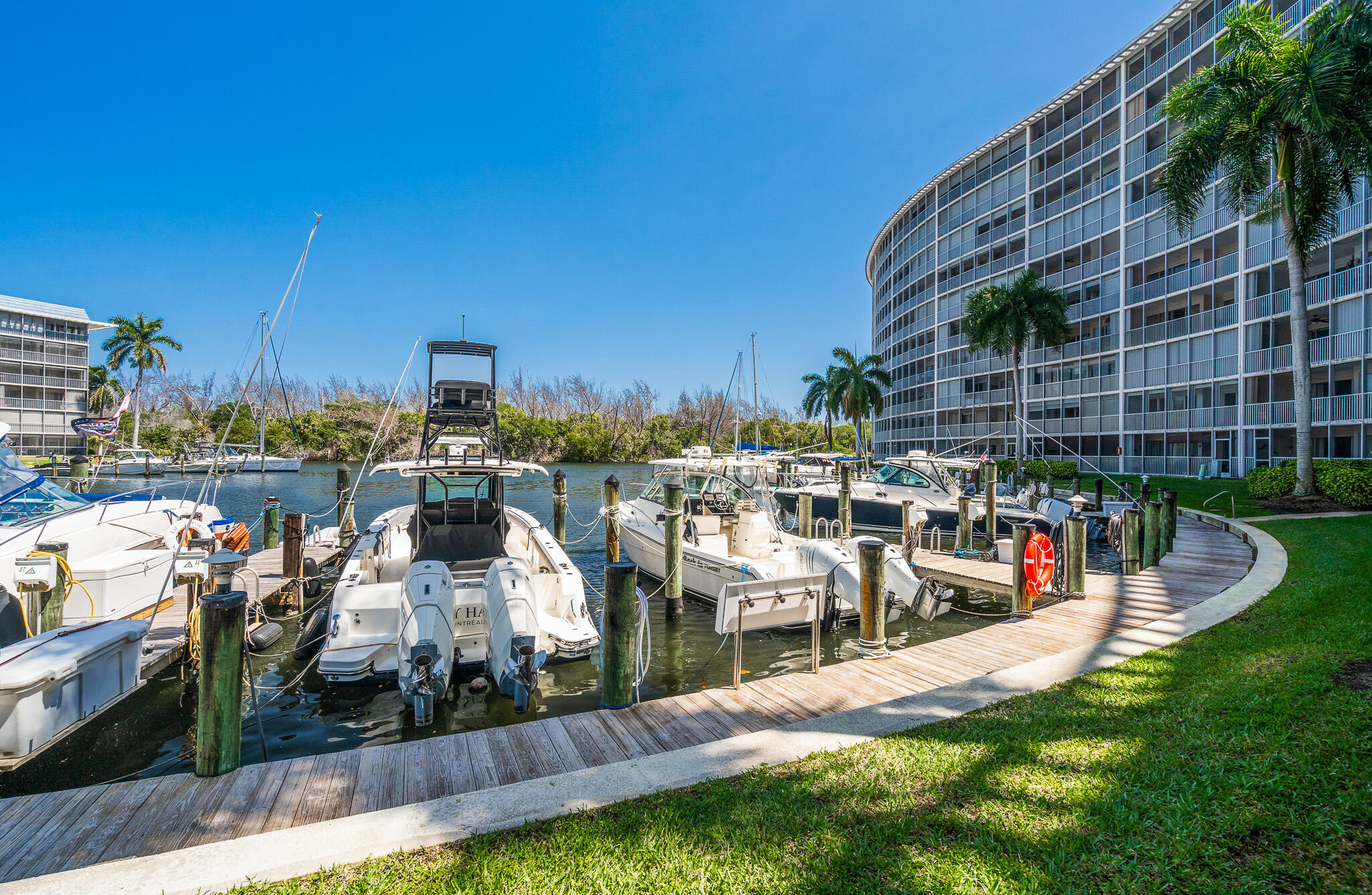 1523 East Hillsboro Boulevard, Unit 531 Deerfield Beach, FL 33441 - Photo 66 of 71 a view of a lake with a building and a big yard