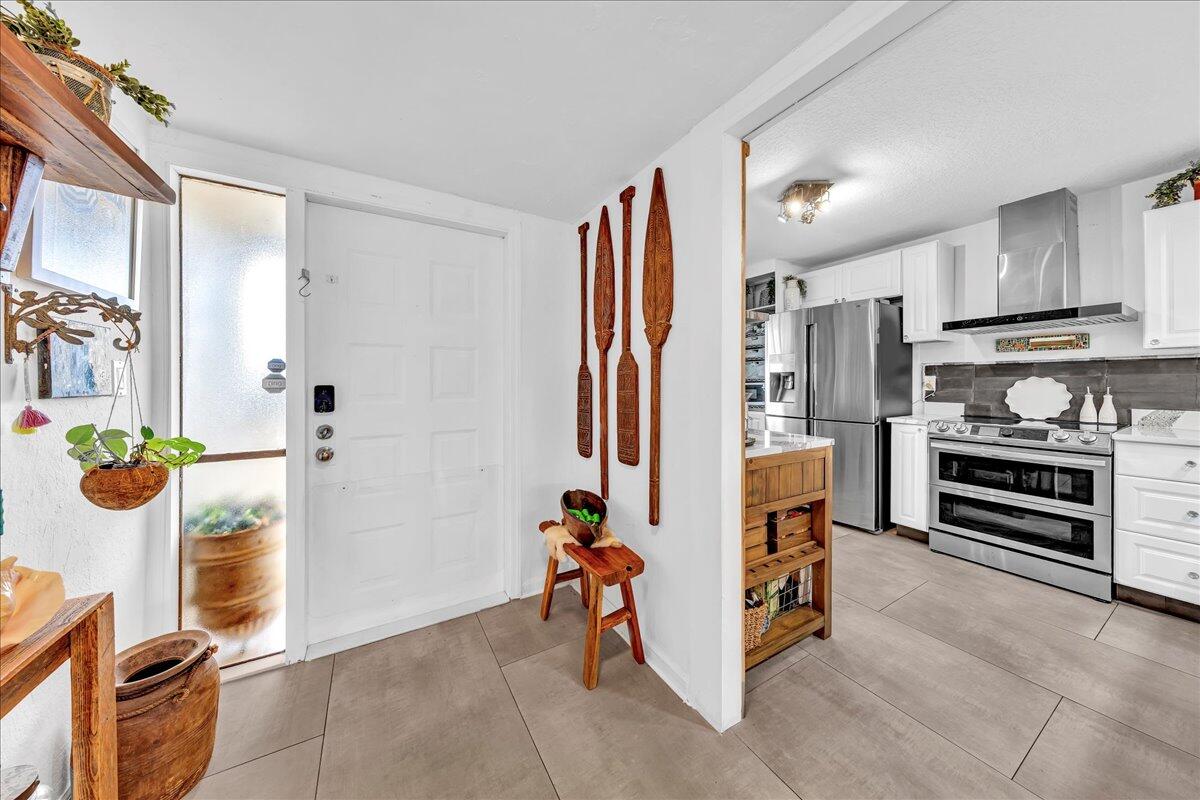 1523 East Hillsboro Boulevard, Unit 531 Deerfield Beach, FL 33441 - Photo 8 of 71 a view of kitchen with stainless steel appliances kitchen island granite countertop a refrigerator and a stove