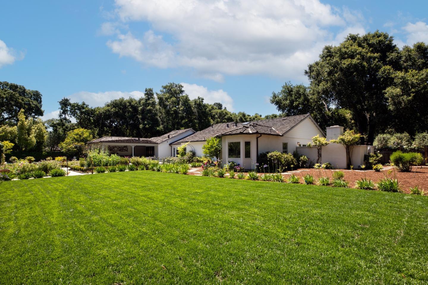 296 Greenoaks Drive Atherton, CA 94027 - Photo 1 of 21 a front view of a house with garden