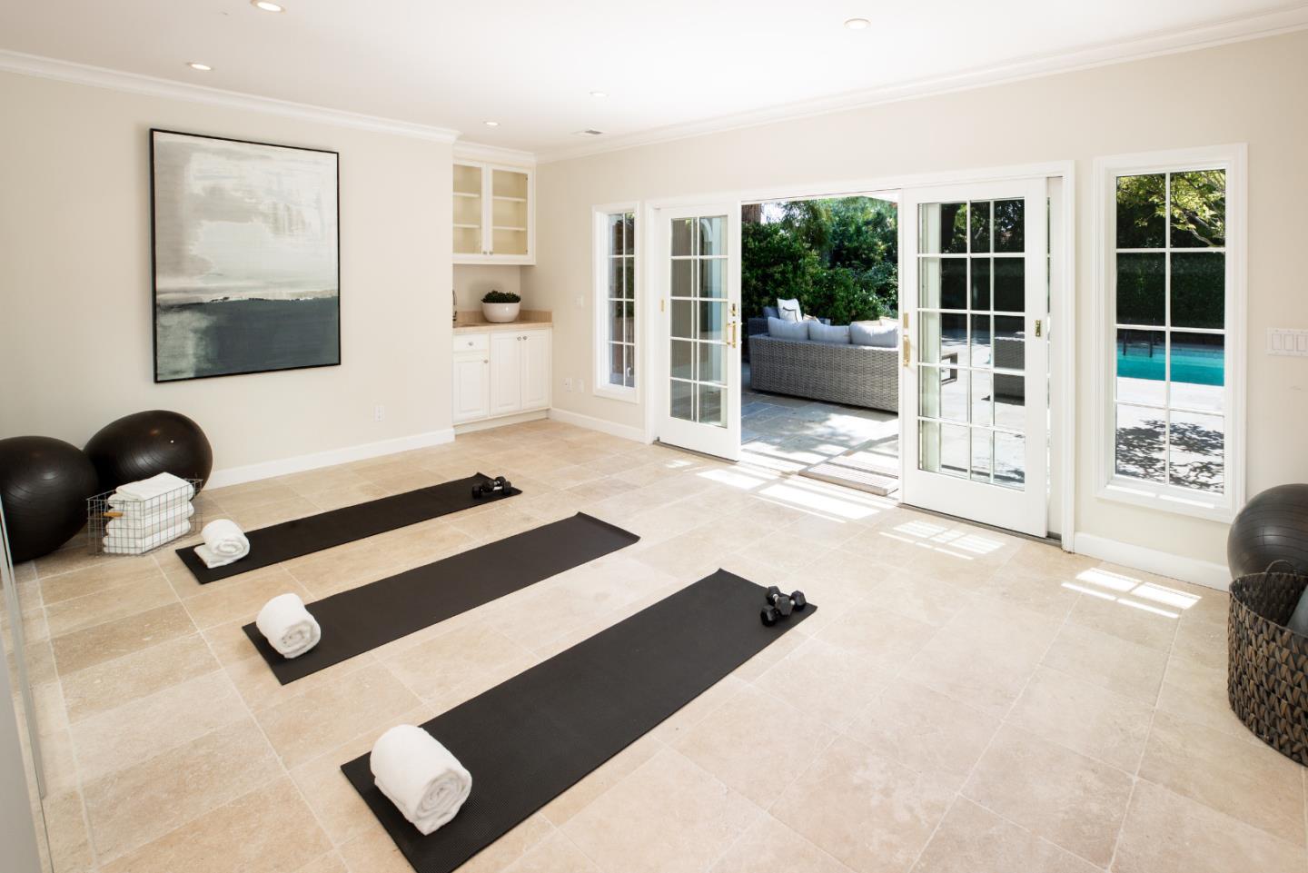 296 Greenoaks Drive Atherton, CA 94027 - Photo 18 of 21 a bedroom with a bed and glass walk in closet