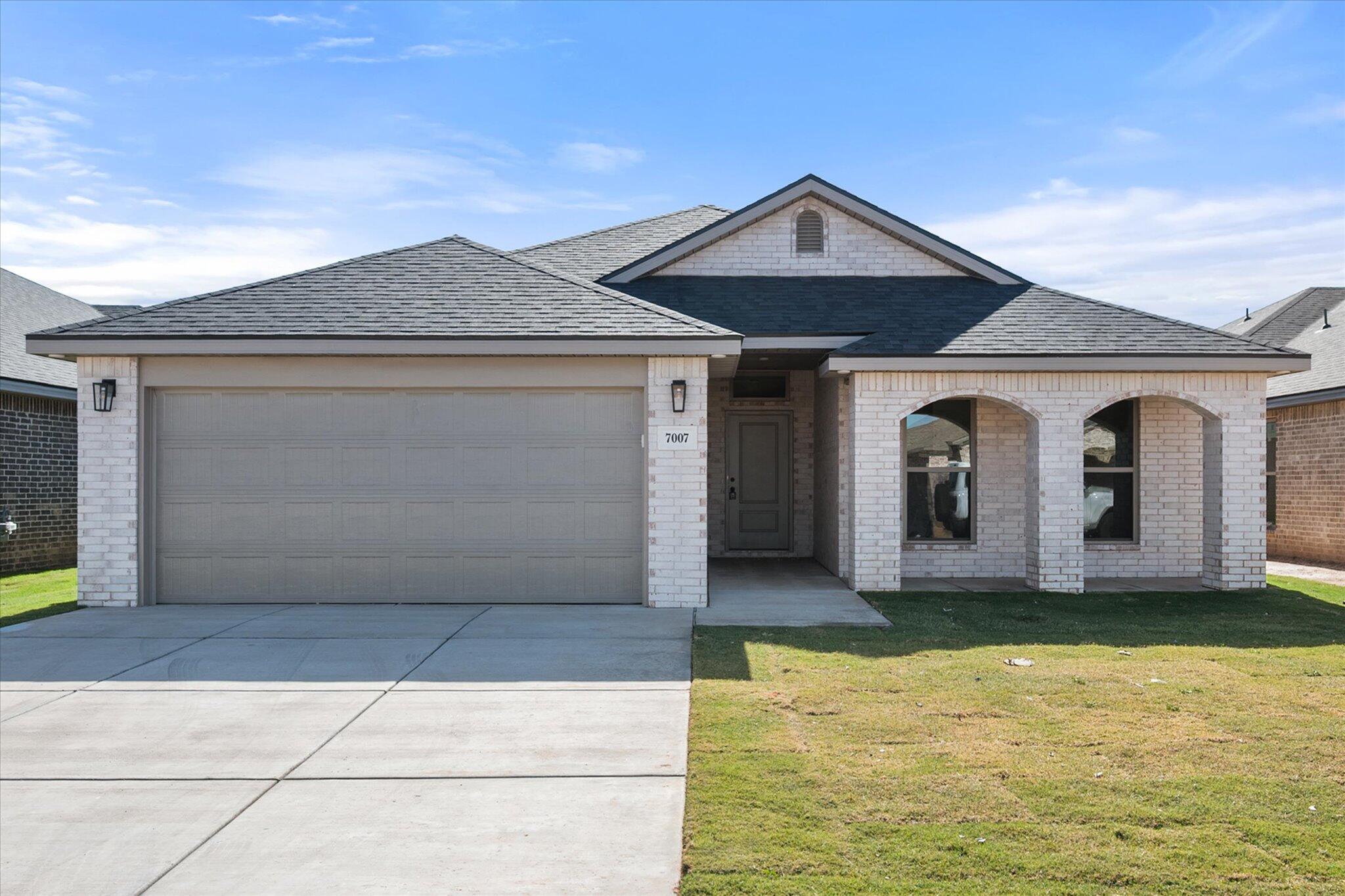 a front view of house with yard