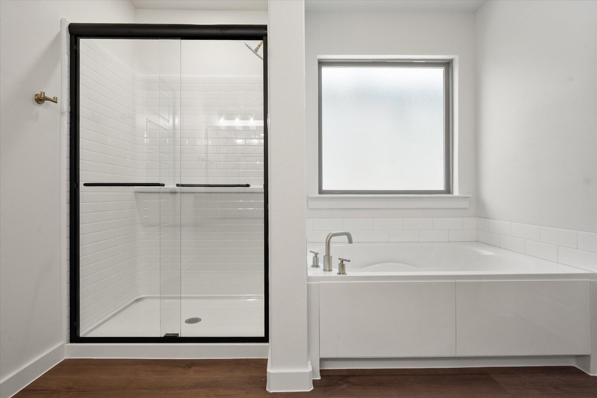 7007 16th Street Lubbock, TX 79416 - Photo 15 of 24 a bathroom with a bathtub