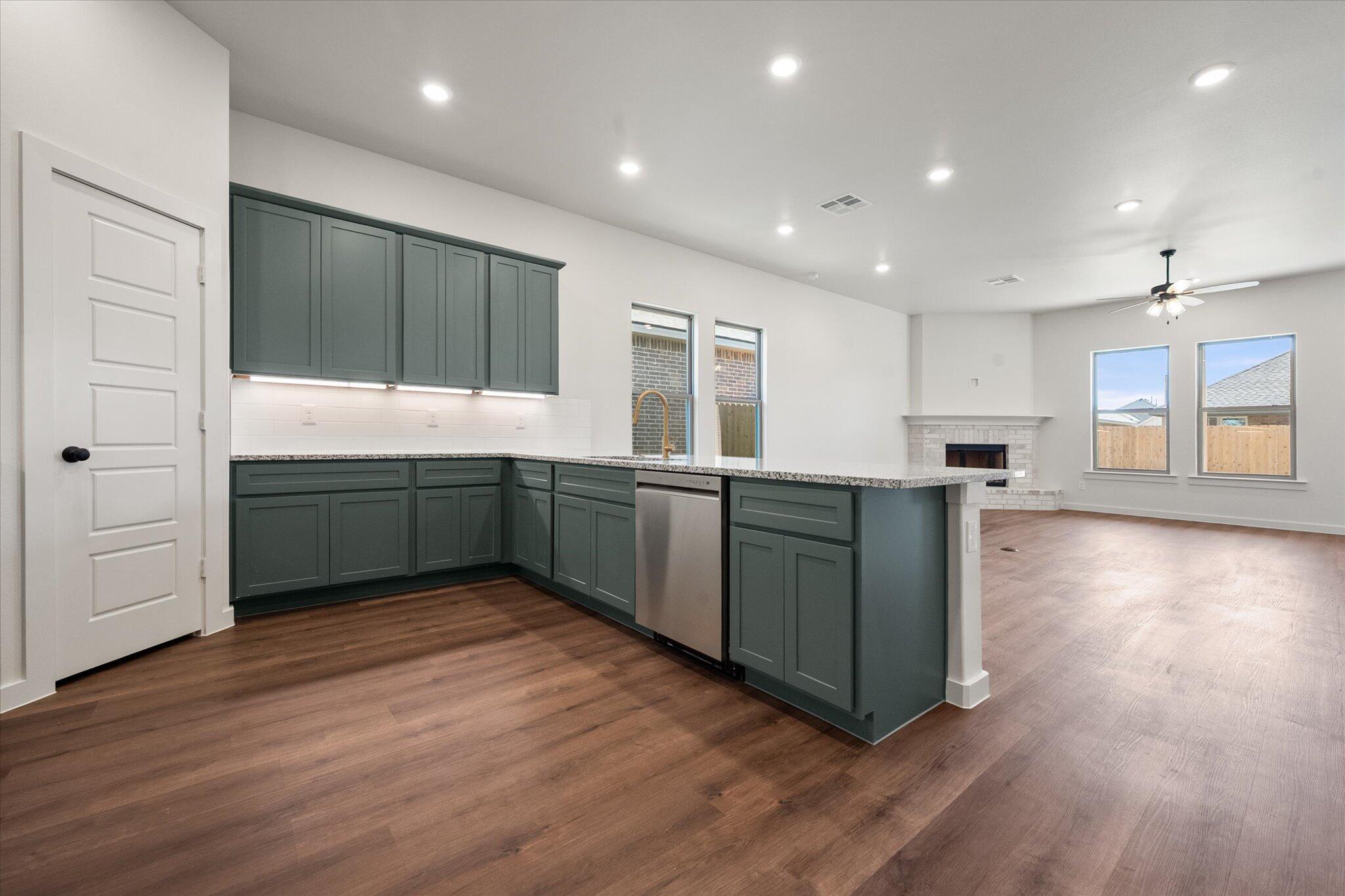 7007 16th Street Lubbock, TX 79416 - Photo 3 of 24 a view of kitchen with wooden floor and window