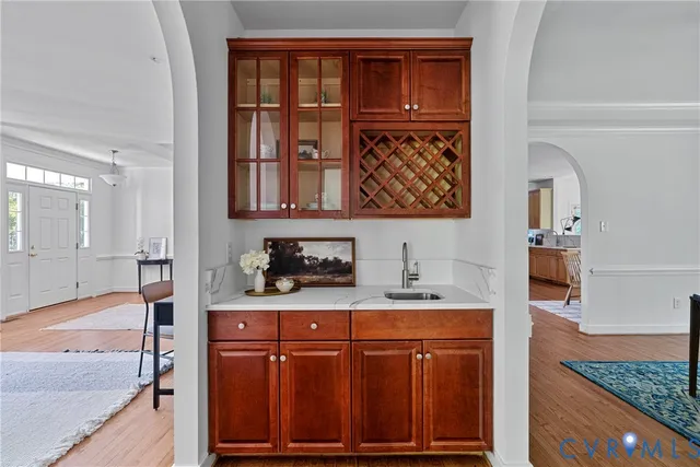 a kitchen with a sink stove and cabinets