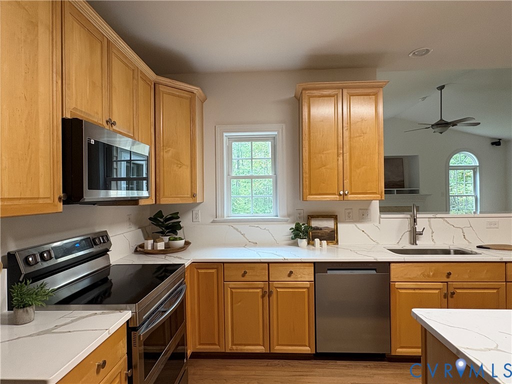 4156 Royal Ridge Court Louisa, VA 23093 - Photo 19 of 50 a kitchen with a sink stove and cabinets