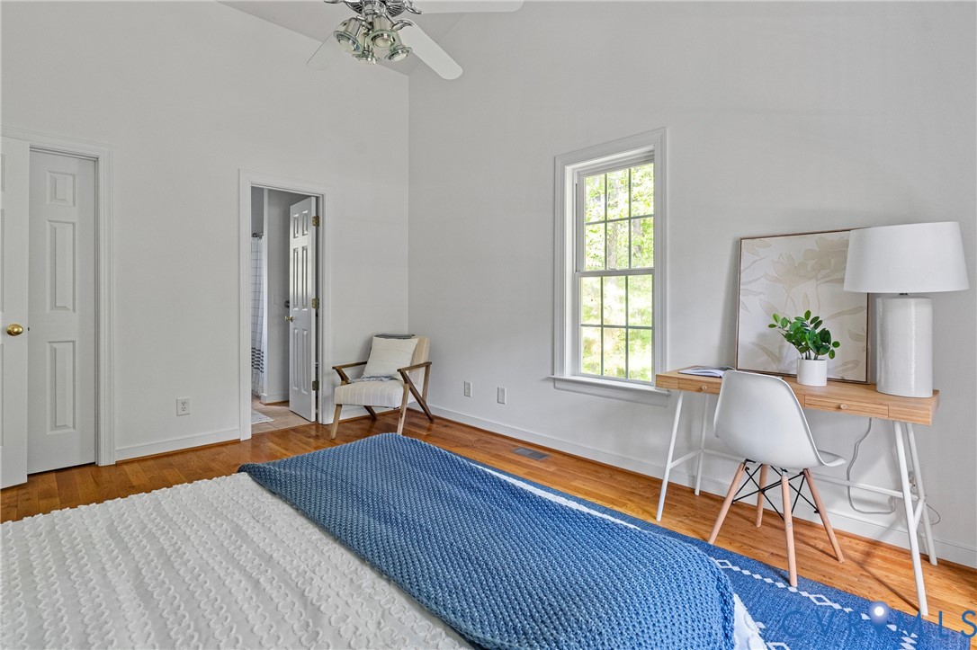 4156 Royal Ridge Court Louisa, VA 23093 - Photo 26 of 50 a bedroom with a bed and a chair