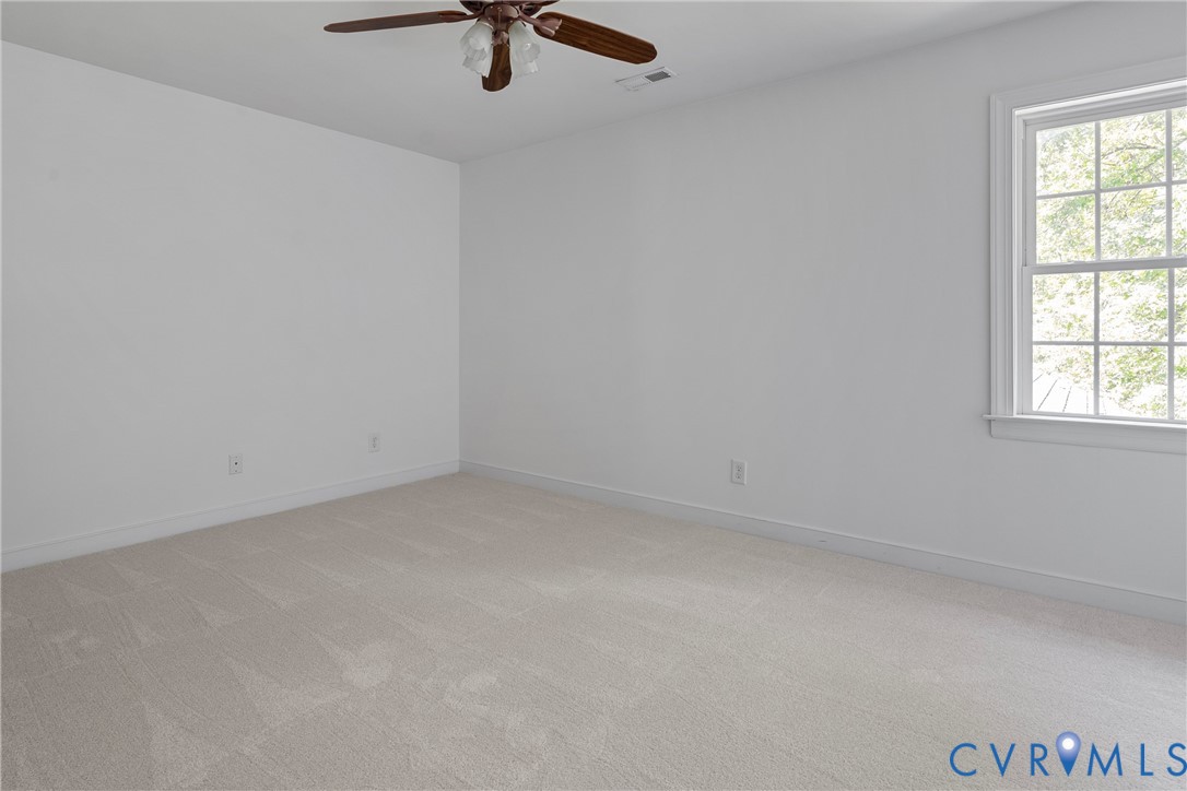 4156 Royal Ridge Court Louisa, VA 23093 - Photo 40 of 50 an empty room with a window and a fan