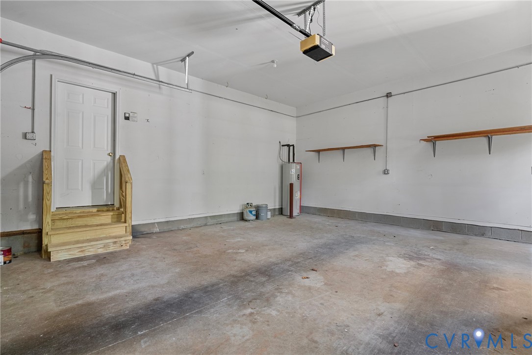 4156 Royal Ridge Court Louisa, VA 23093 - Photo 43 of 50 An oversized garage with workshop area and new sta