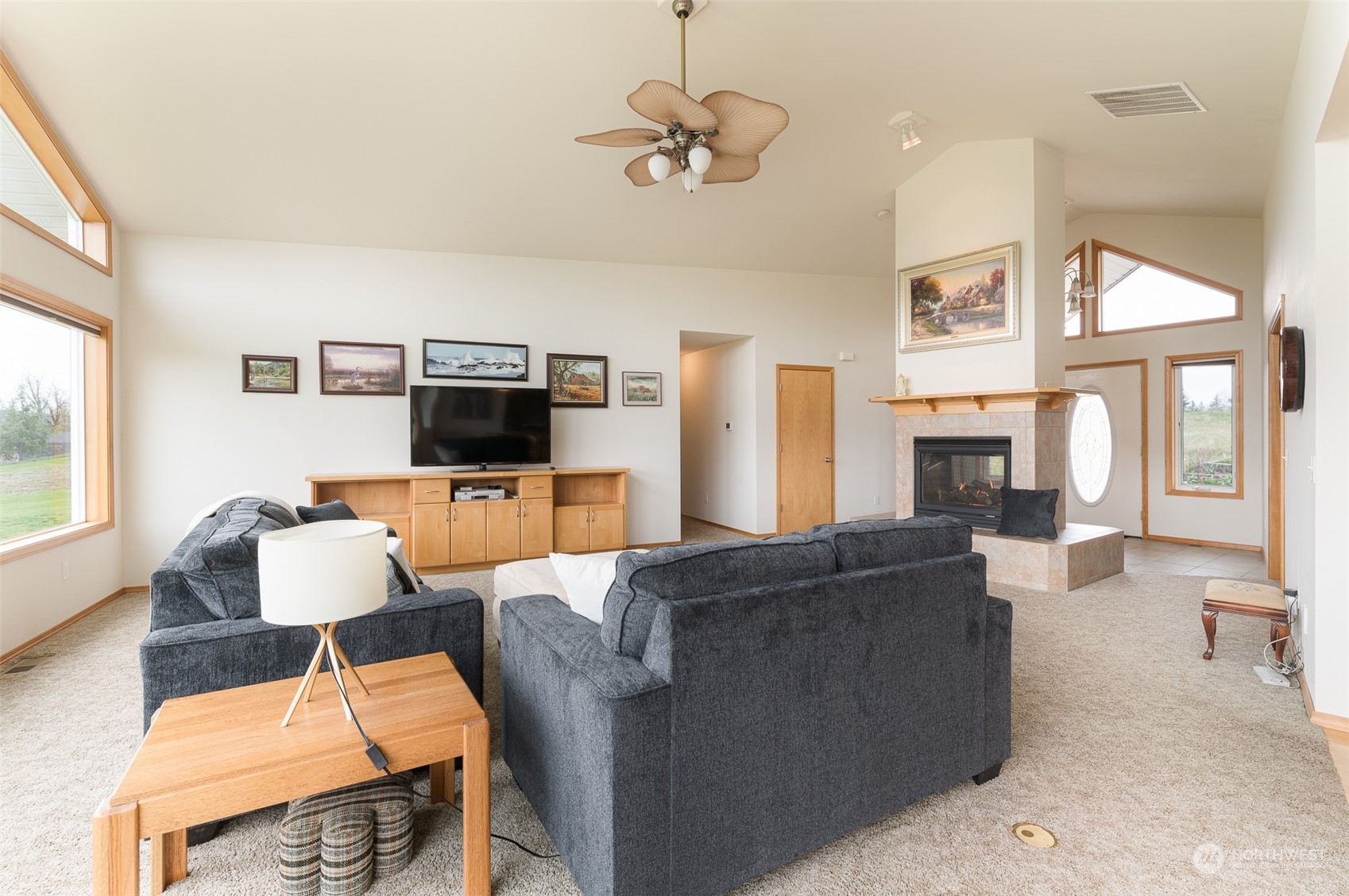 2131 Central Road Everson, WA 98247 - Photo 11 of 40 a living room with furniture a flat screen tv and a large window