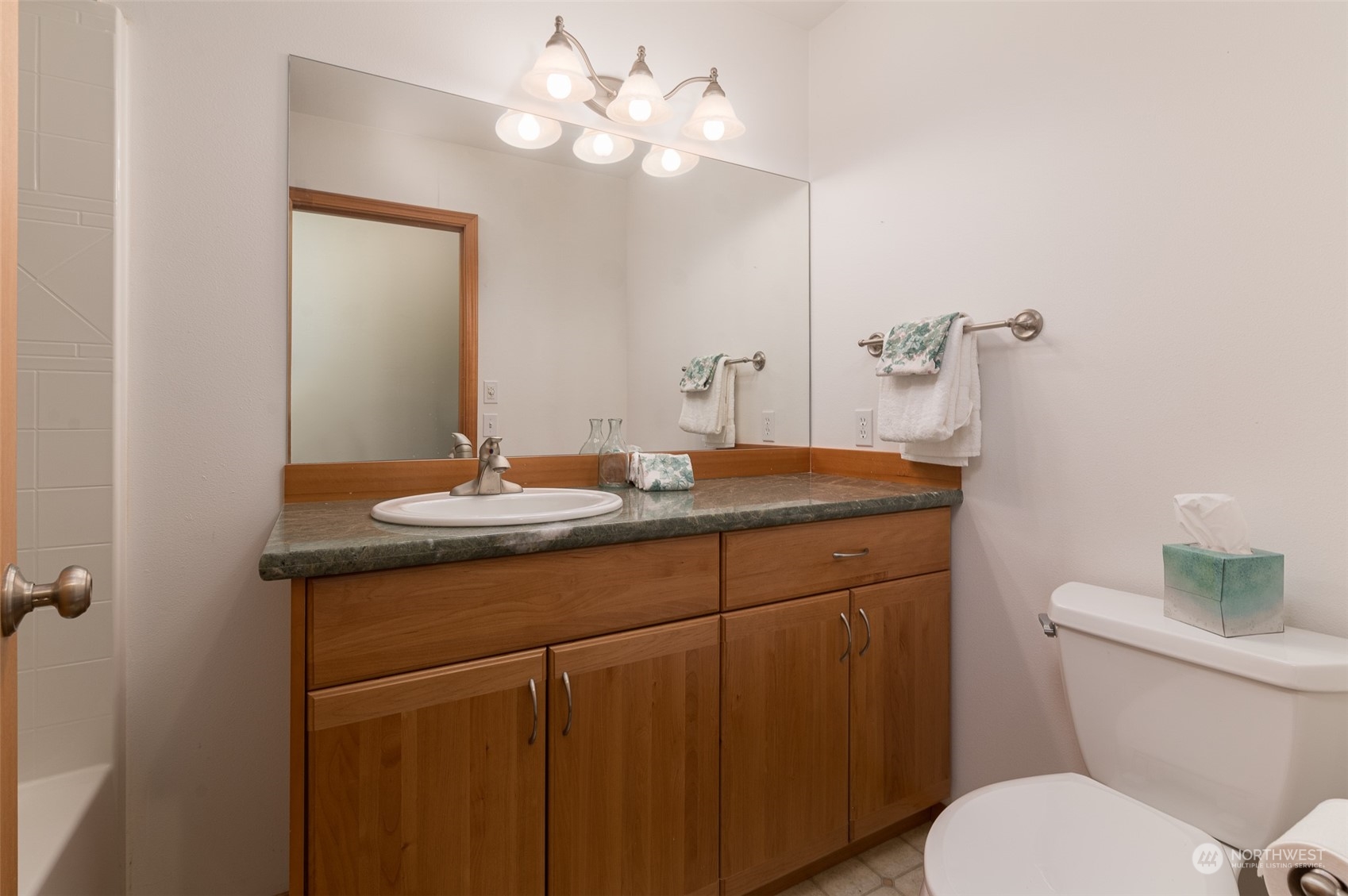 2131 Central Road Everson, WA 98247 - Photo 21 of 40 a bathroom with a granite countertop toilet sink and mirror