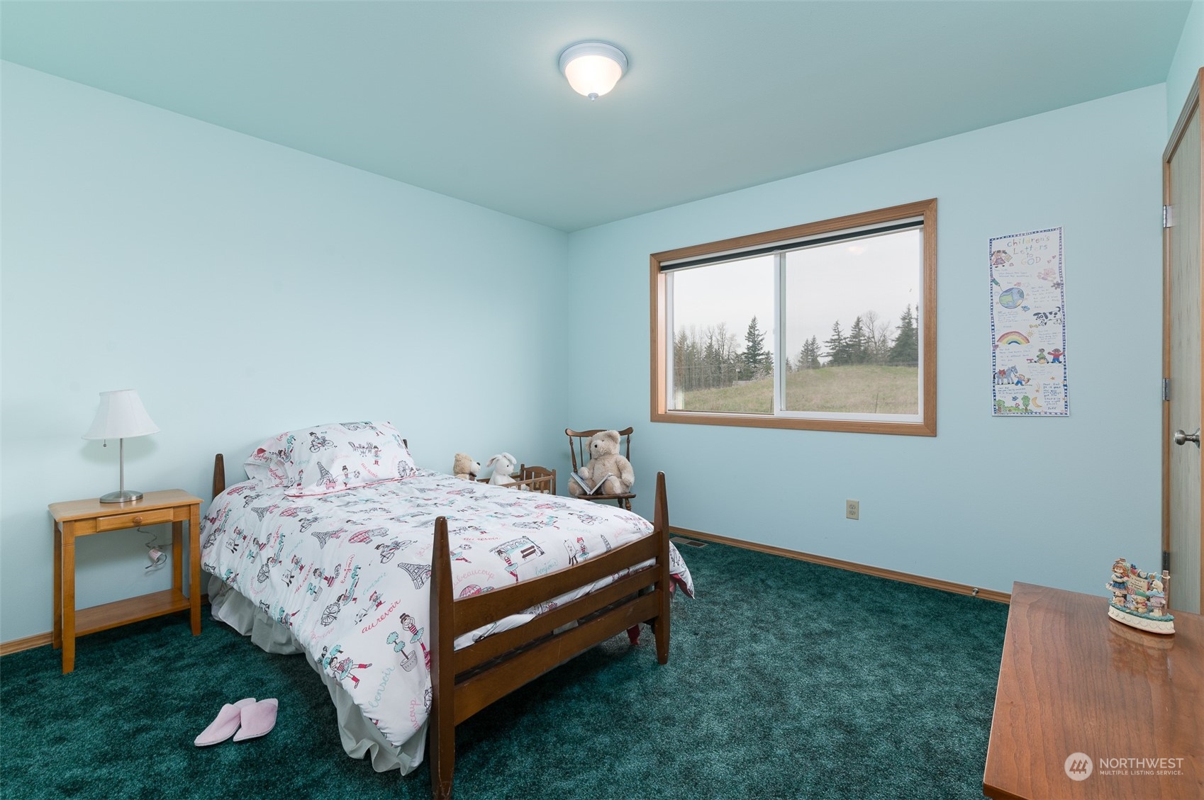 2131 Central Road Everson, WA 98247 - Photo 23 of 40 a bed sitting in a bedroom next to a window