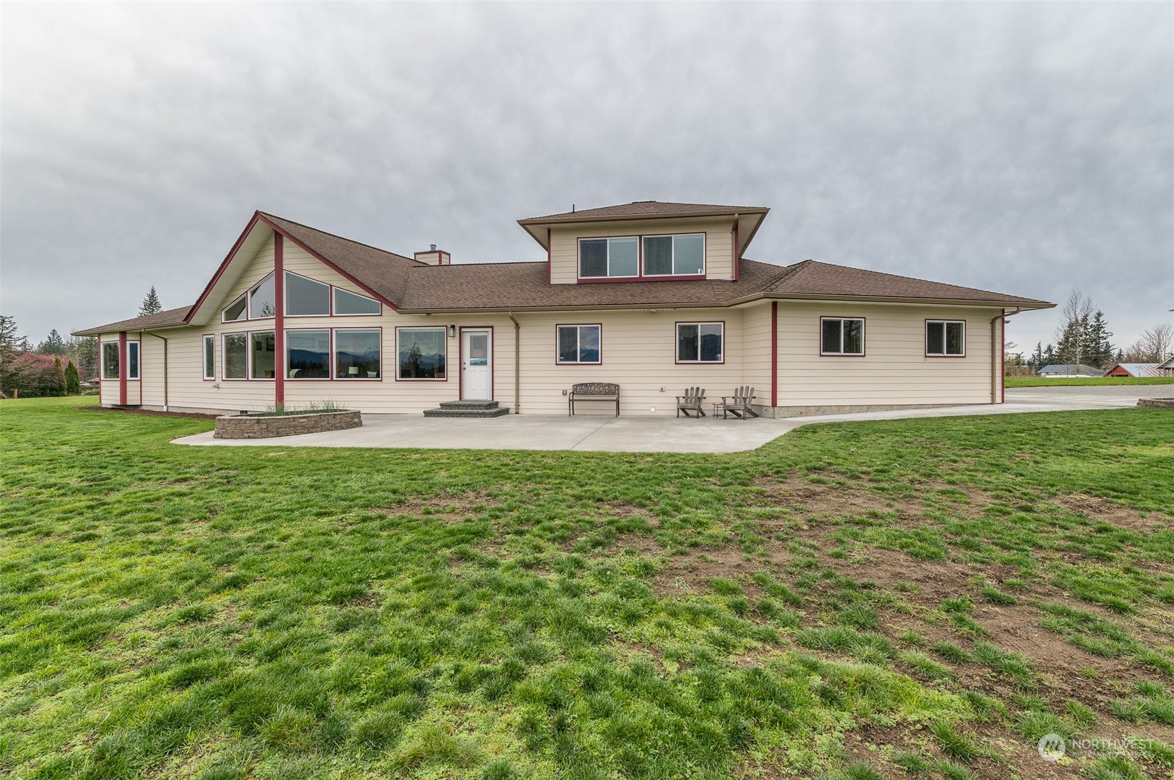 2131 Central Road Everson, WA 98247 - Photo 6 of 40 a front view of a house with a garden and trees
