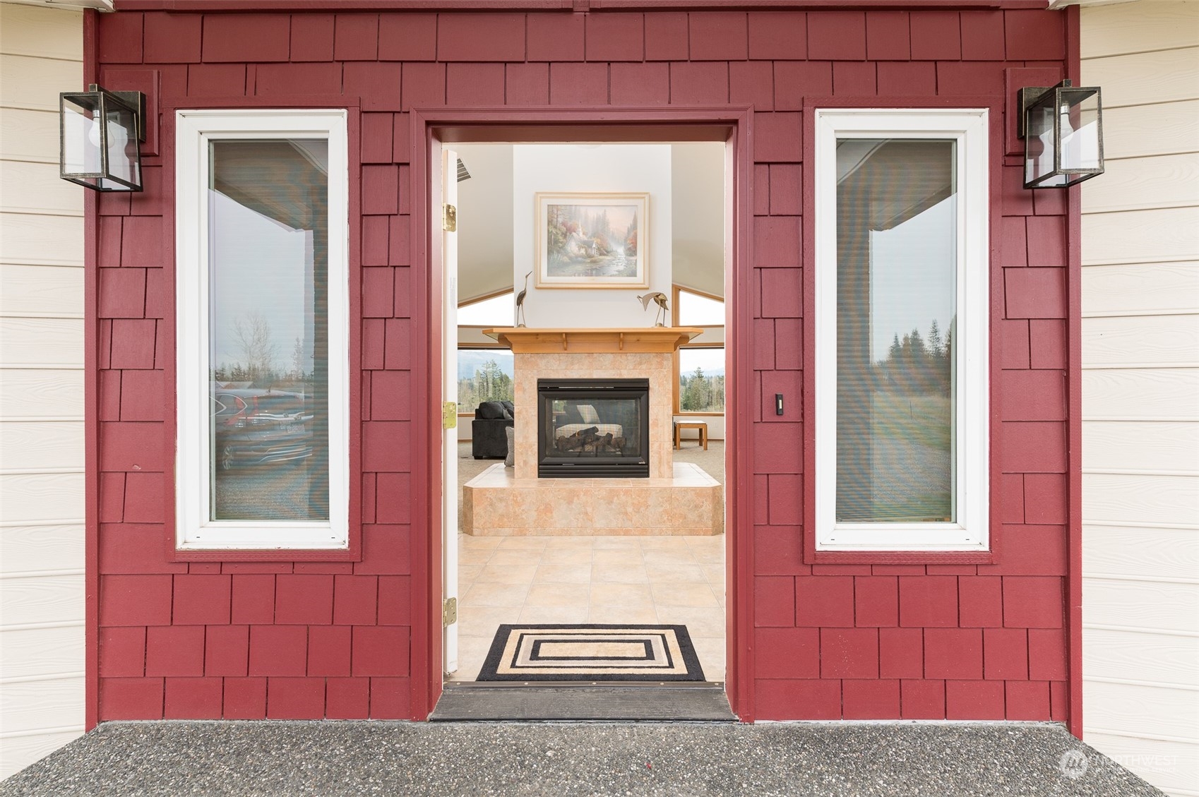 2131 Central Road Everson, WA 98247 - Photo 8 of 40 a view of a brick house with a red door and a large window