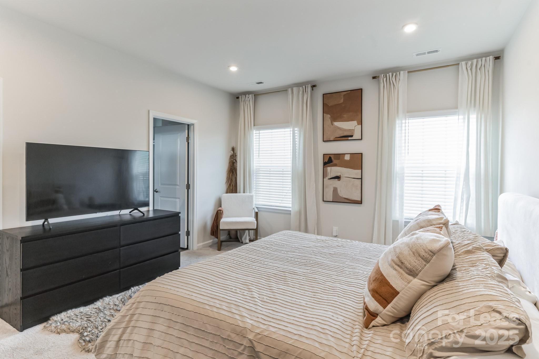 5048 Patton Dr. Gastonia, NC 28056 - Photo 19 of 37 a bedroom with a bed and a television