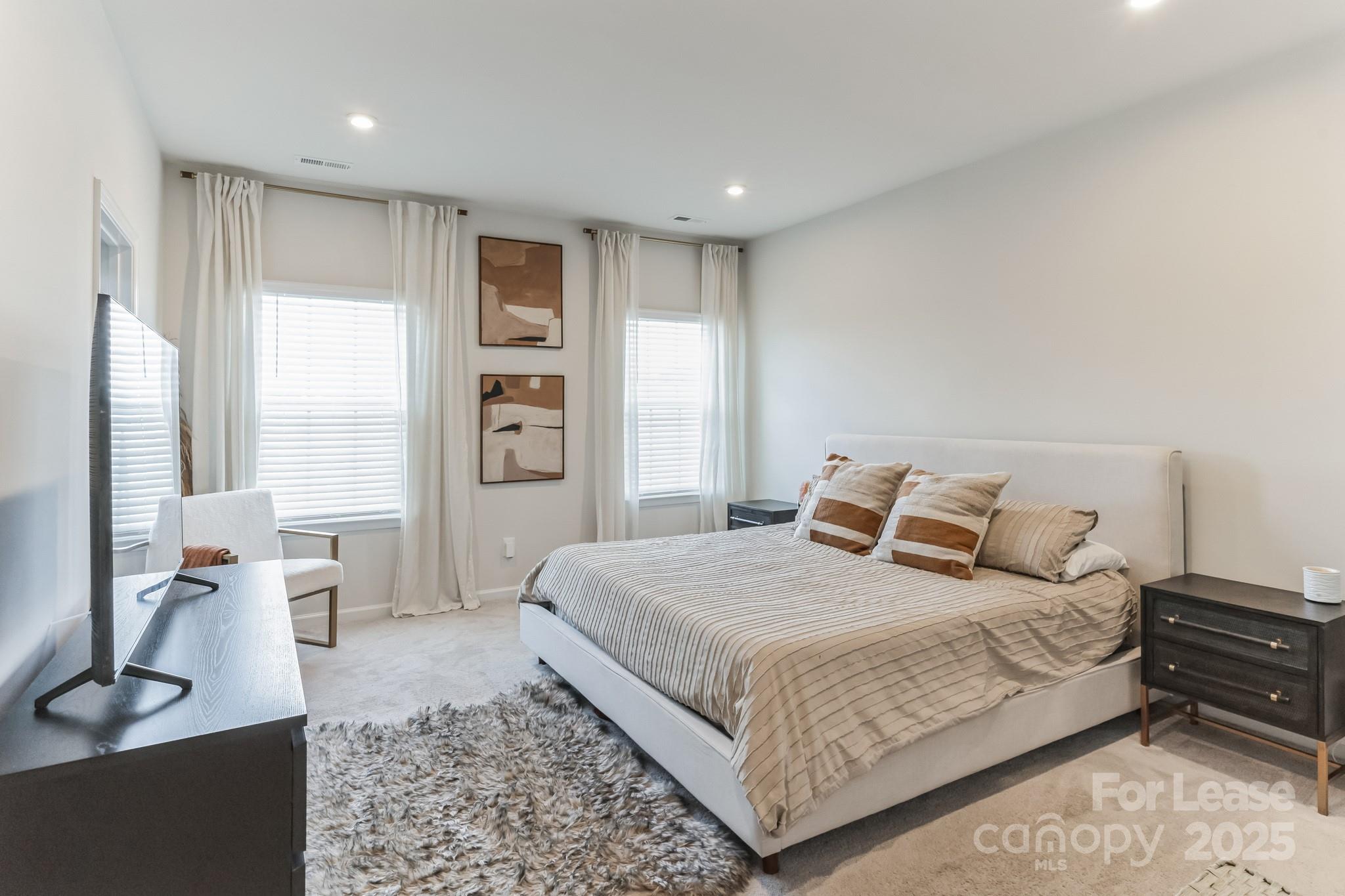 5048 Patton Dr. Gastonia, NC 28056 - Photo 20 of 37 a bedroom with a large bed and a couch