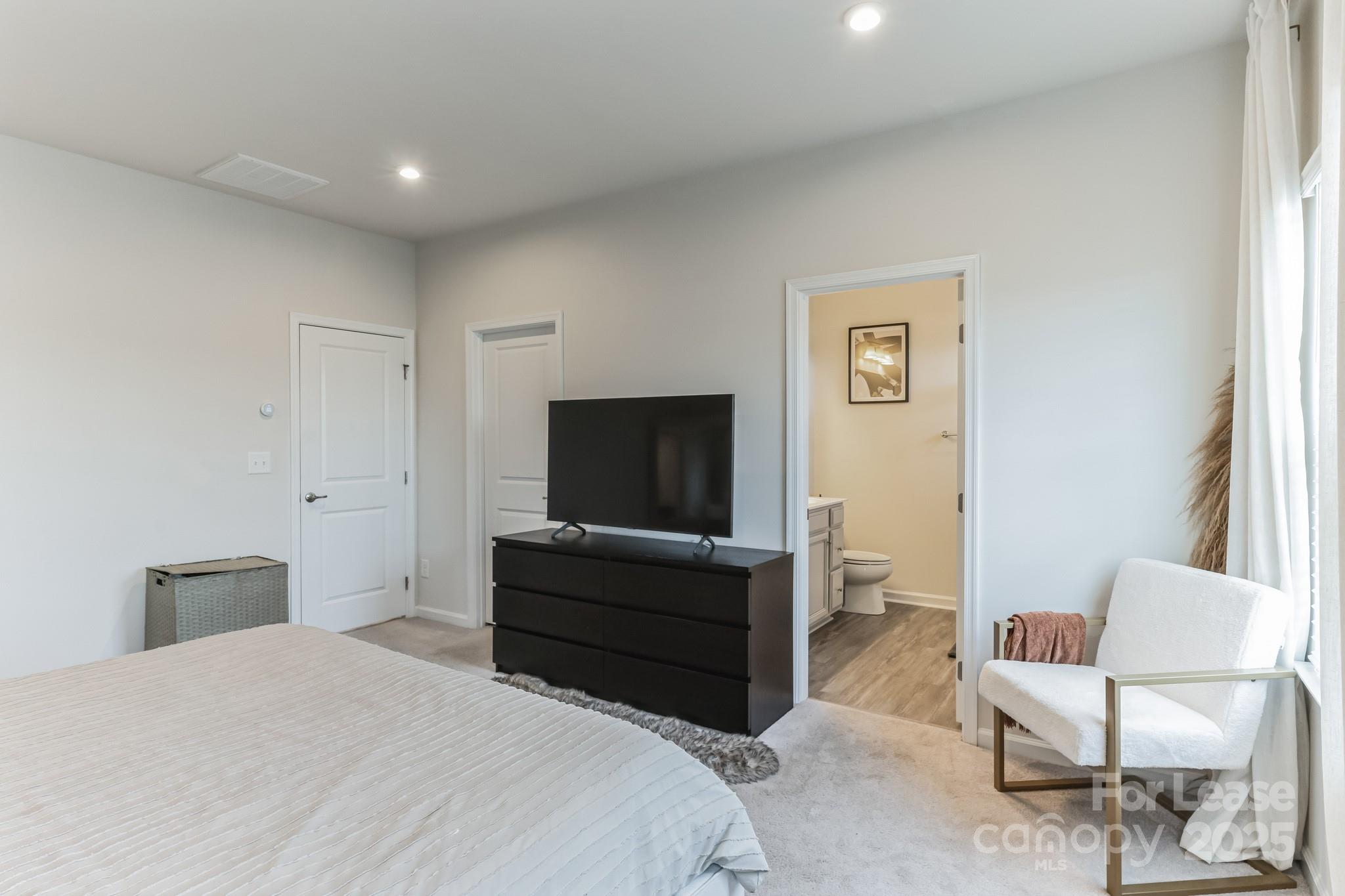 5048 Patton Dr. Gastonia, NC 28056 - Photo 21 of 37 a bedroom with a bed and a television