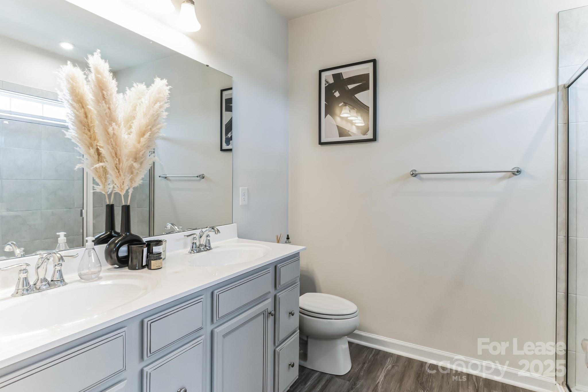 5048 Patton Dr. Gastonia, NC 28056 - Photo 23 of 37 a bathroom with a toilet sink and mirror