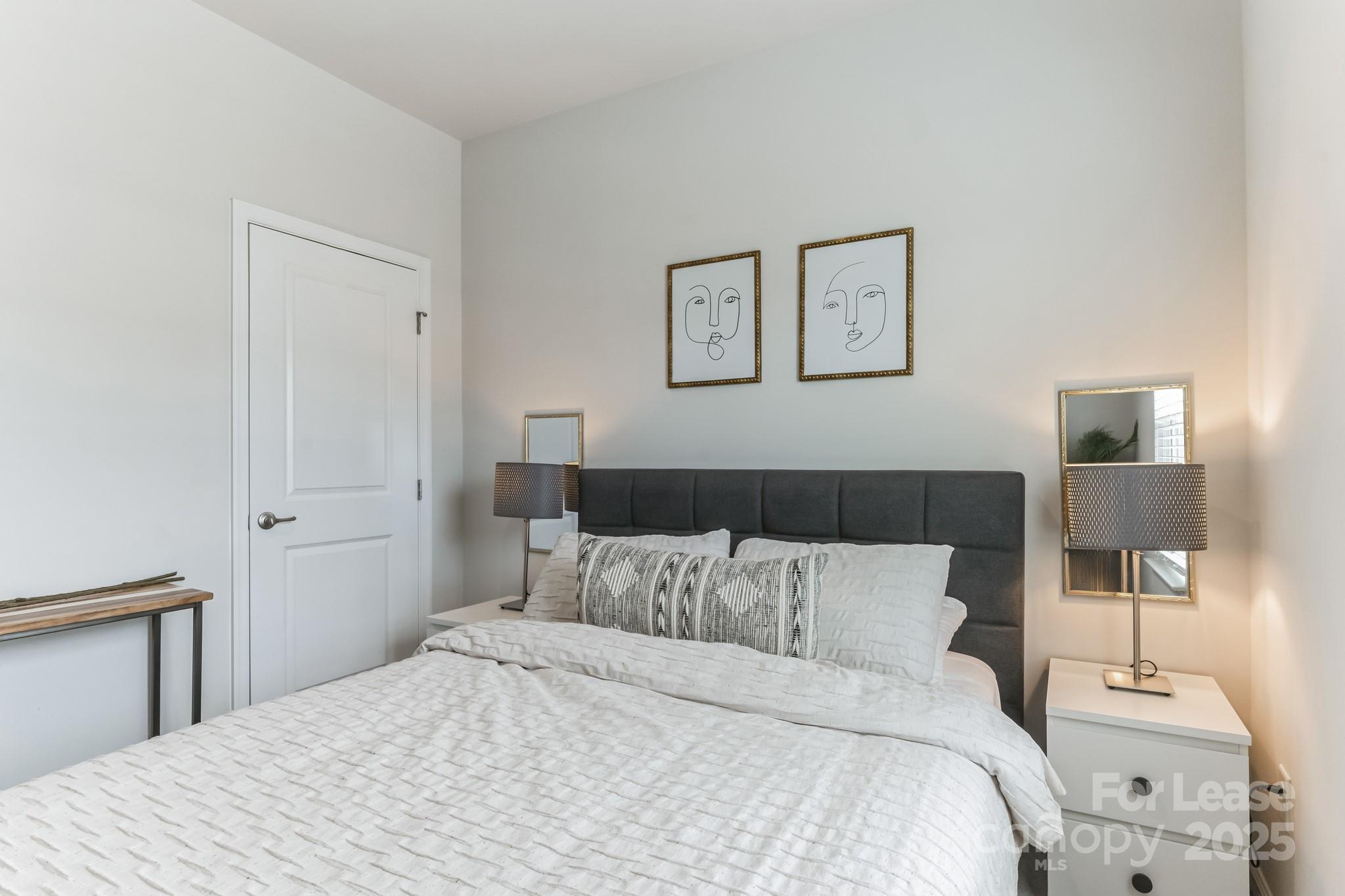 5048 Patton Dr. Gastonia, NC 28056 - Photo 25 of 37 a bedroom with a bed and a lamp