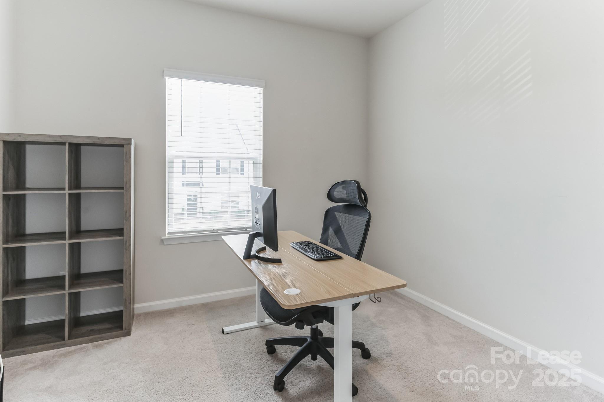 5048 Patton Dr. Gastonia, NC 28056 - Photo 30 of 37 a view of a workspace with furniture and a window