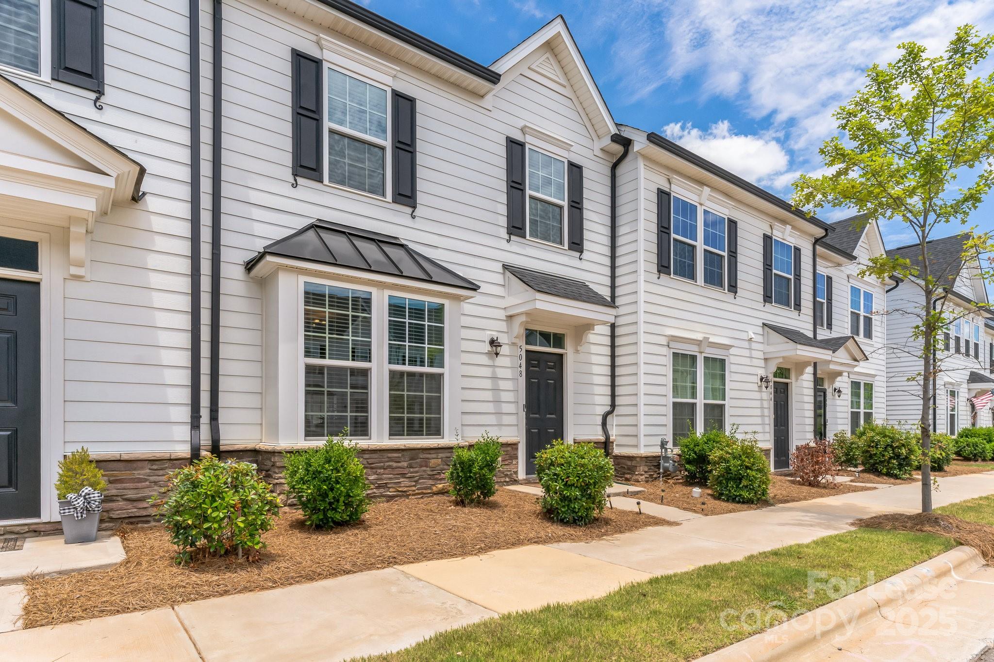 5048 Patton Dr. Gastonia, NC 28056 - Photo 3 of 37 a front view of a house with garden