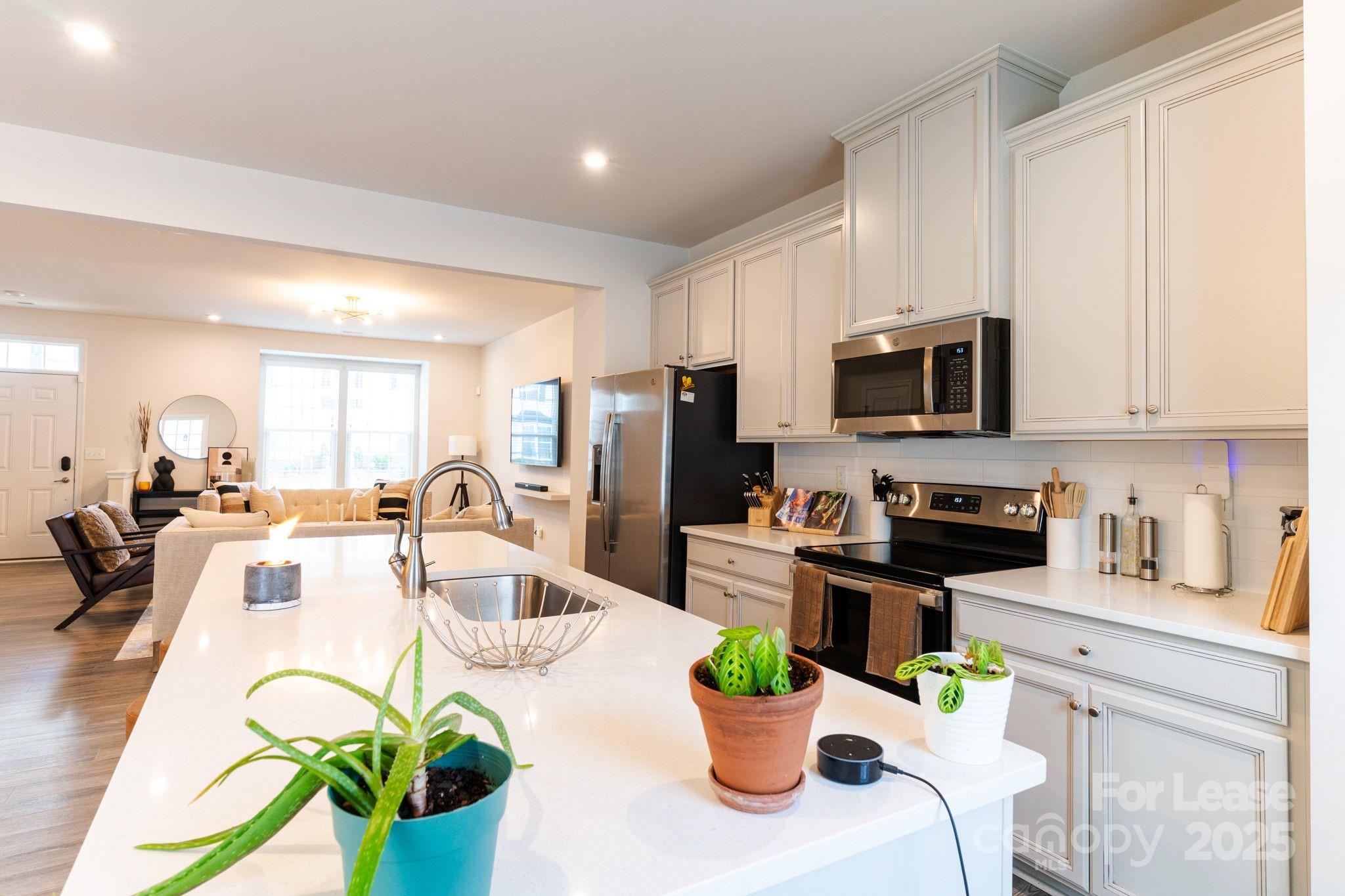 5048 Patton Dr. Gastonia, NC 28056 - Photo 7 of 37 a view of a kitchen with dining table and appliances