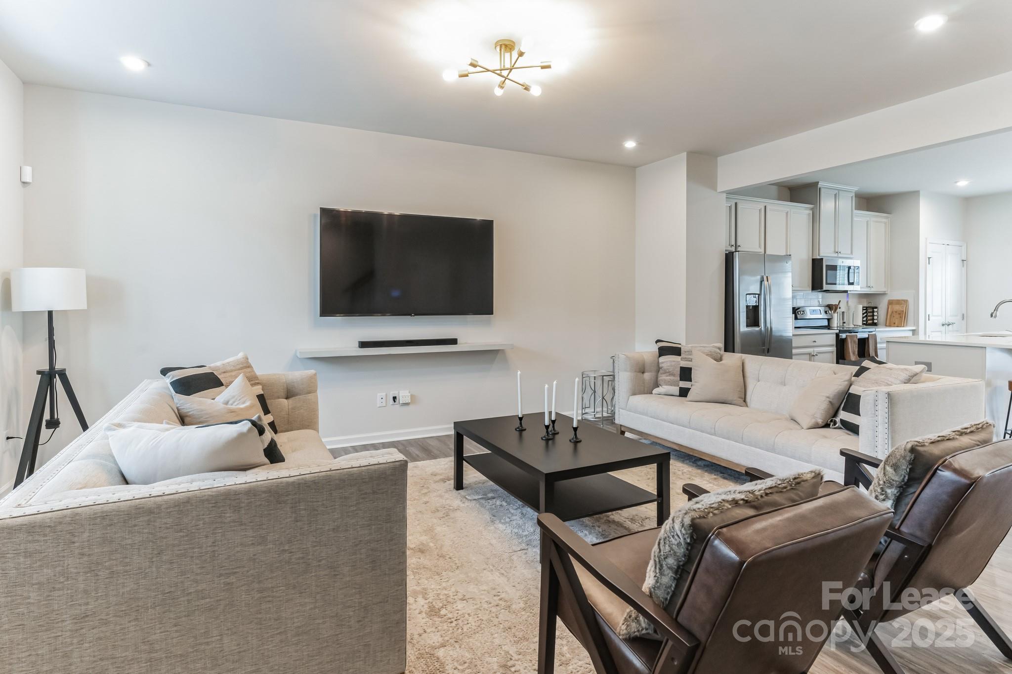 5048 Patton Dr. Gastonia, NC 28056 - Photo 10 of 37 a living room with furniture and a flat screen tv
