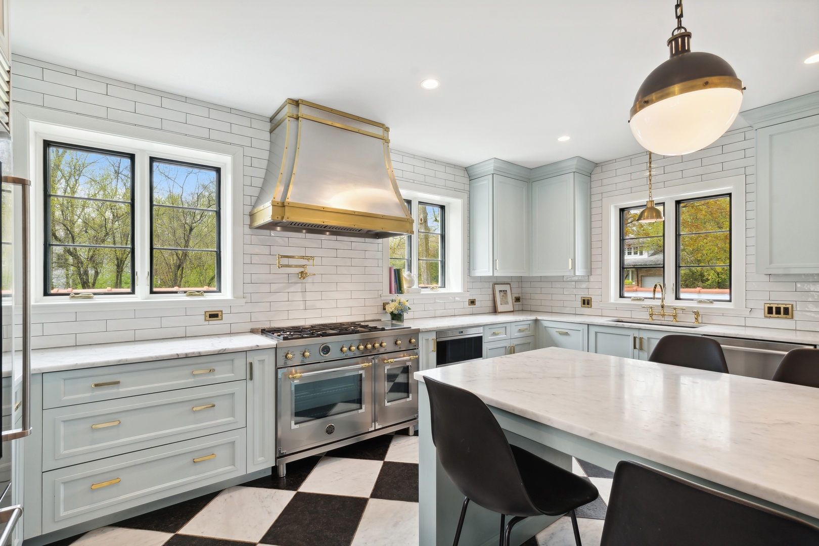 220 Dewindt Road Winnetka, IL 60093 - Photo 21 of 53 a kitchen with a stove a sink and a refrigerator