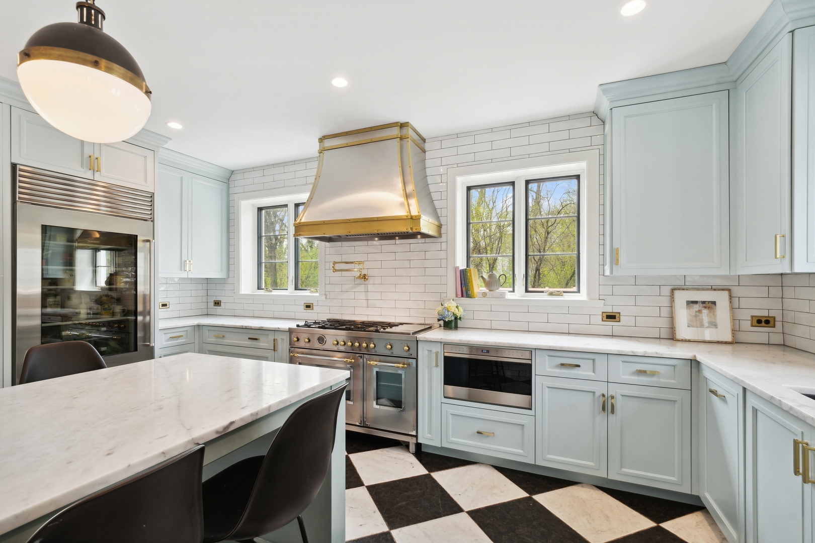220 Dewindt Road Winnetka, IL 60093 - Photo 25 of 53 a kitchen with a sink a stove and cabinets