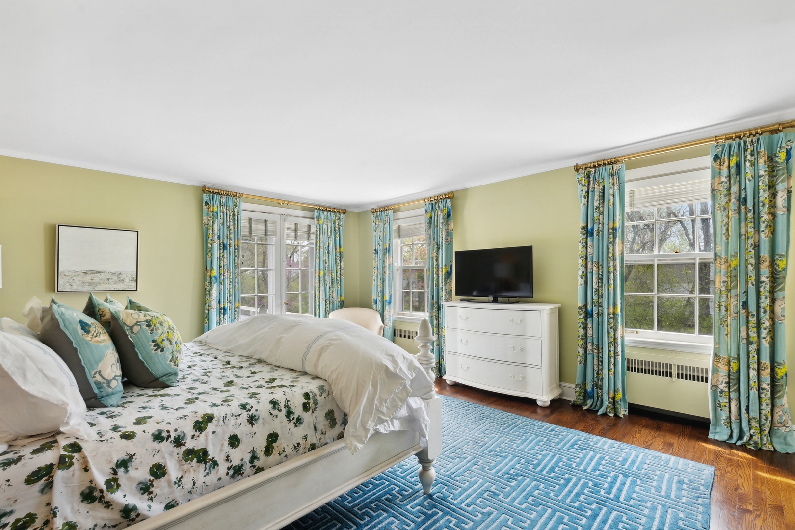 220 Dewindt Road Winnetka, IL 60093 - Photo 34 of 53 a bedroom with a bed and a flat screen tv