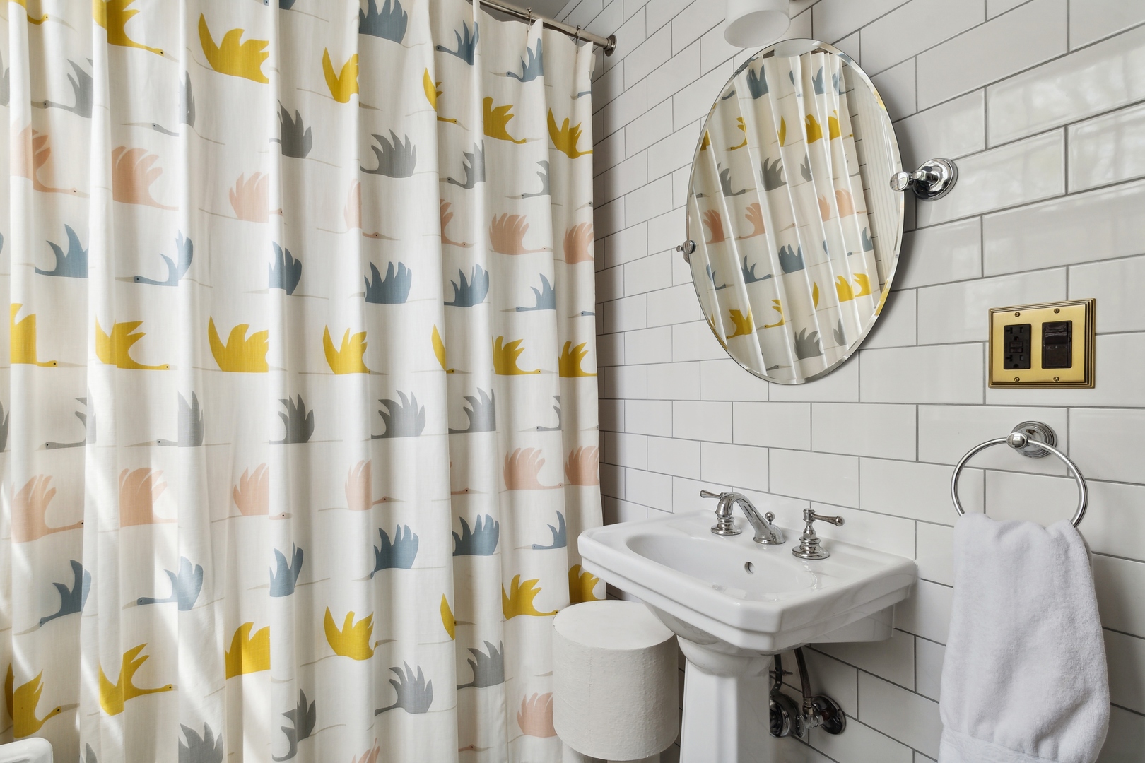 220 Dewindt Road Winnetka, IL 60093 - Photo 43 of 53 a bathroom with a sink a mirror and a shower curtain